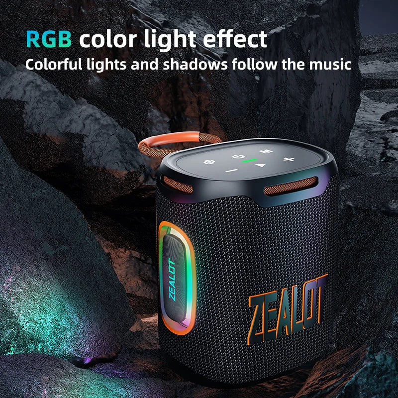 Black portable speaker with RGB lighting effects on a rocky background