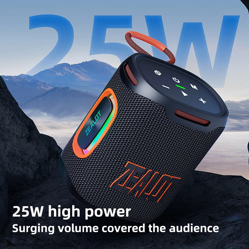 Black portable speaker with orange accents on a mountain background, featuring the brand 'Zealot'.
