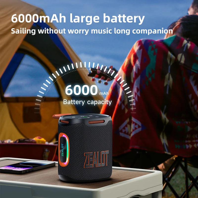 ZEALOT Bluetooth speaker with 6000mAh battery capacity on a table outdoors.