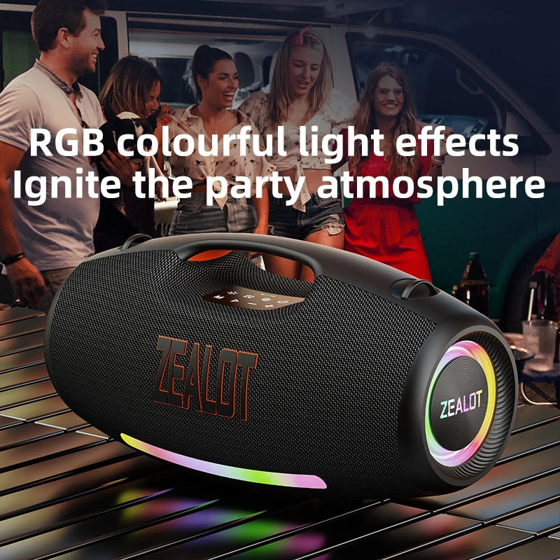 Black portable speaker with colorful light effects on a table, surrounded by people in a party setting.